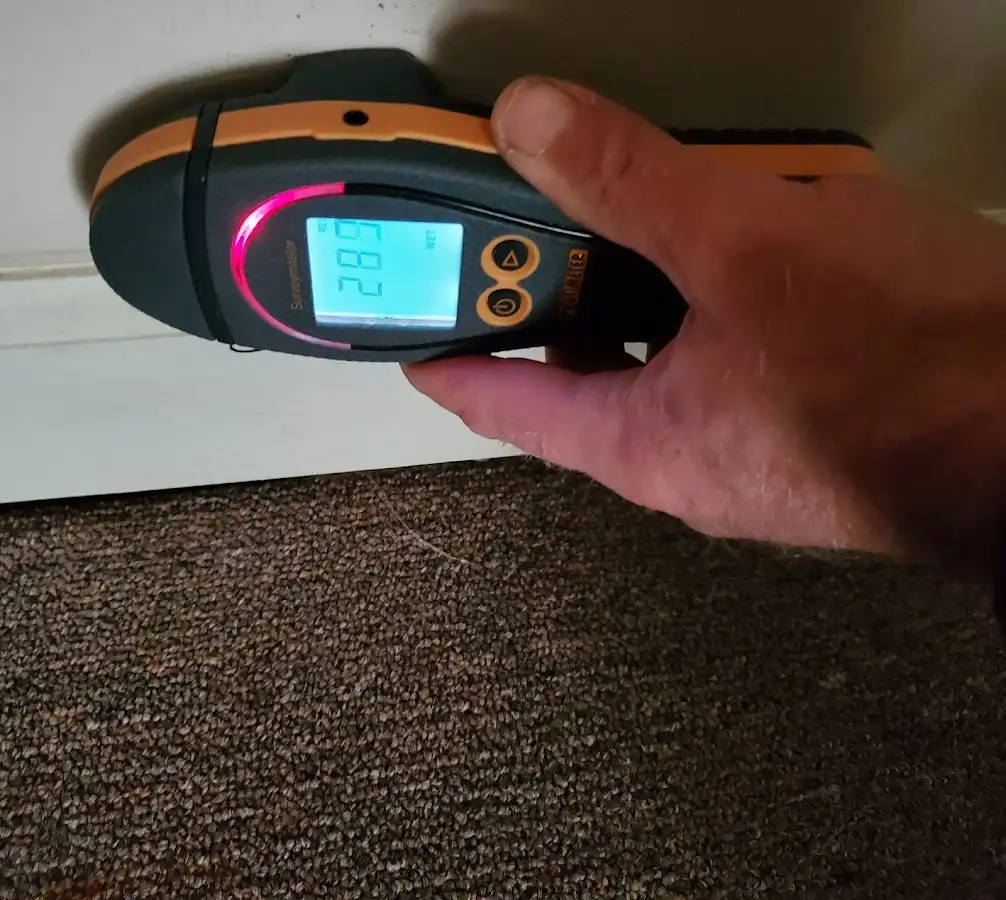 Moisture detection at baseboard during Storm Damage Restoration in Fairfield